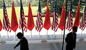 China, U.S. officials downplay anti-trade rhetoric