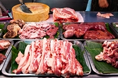 China trims anti-dumping levy on EU pork, keeps measures for five years
